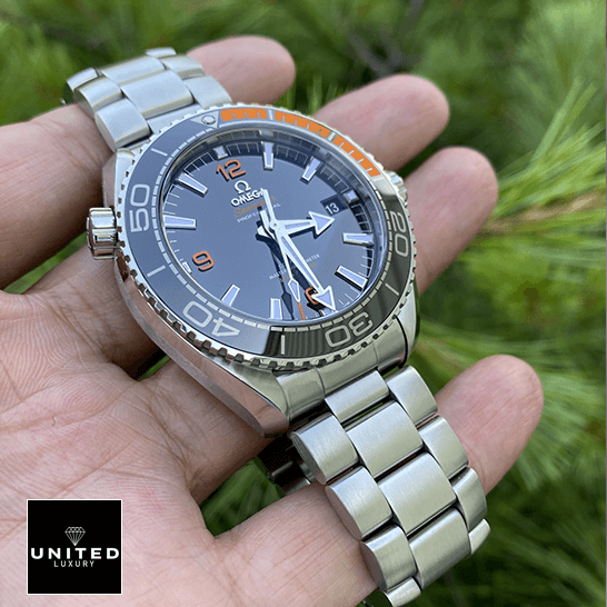 Omega Seamaster Planet Ocean Co-Axial Master Chronometer 215.30.44.21.01.002 Exact Replica 1:1 omega seamaster planet ocean steel Omega Seamaster Black Dial Oyster Bracelet Replica on the hand & grass background